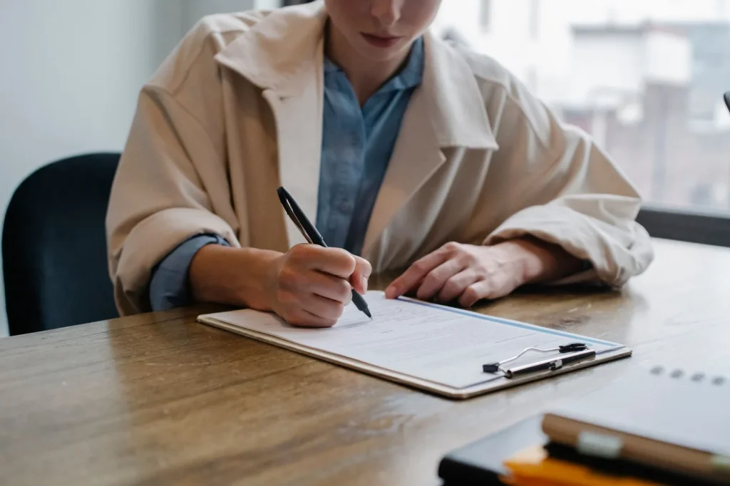 Buyer evaluating options with a written checklist
